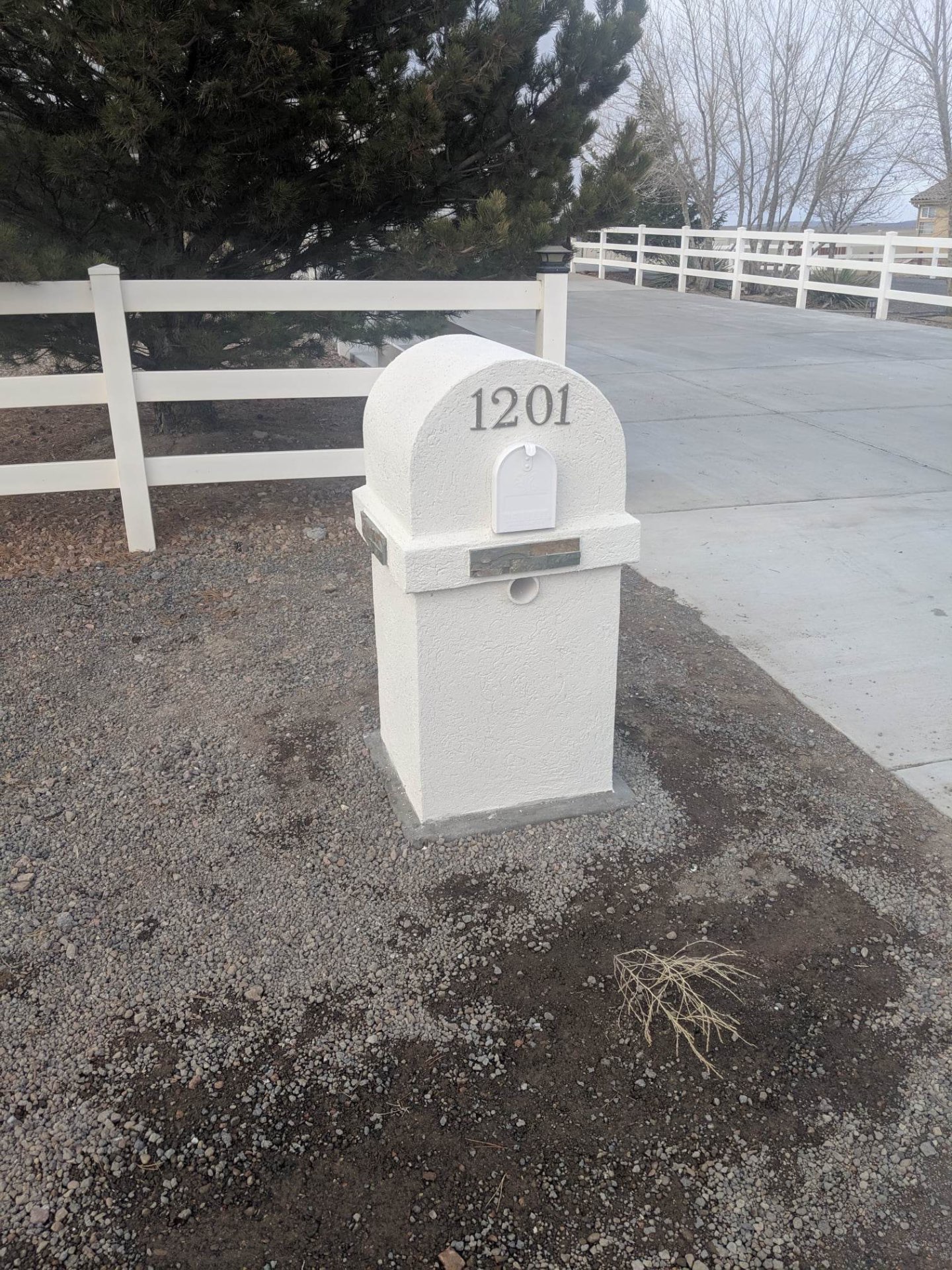 Custom stucco mailbox with stone accent