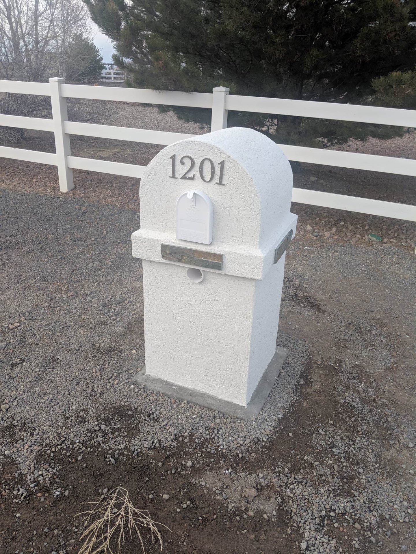 Stucco mailbox with house numbers